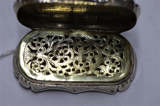 A Victorian silver shaped oval vinaigrette by Nathaniel Mills, the lid engraved with landscape scene,